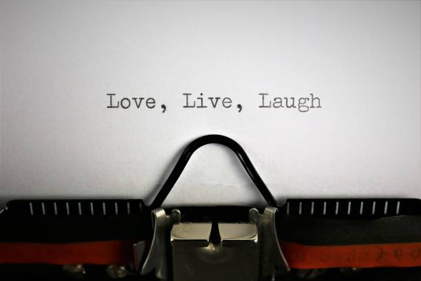 istock An concept Image of a typewriter with the text, Love, Live, Laugh 892029474
