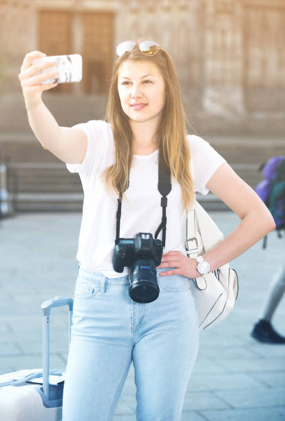 istock Young  traveler walking the city and doing selfie 892039376