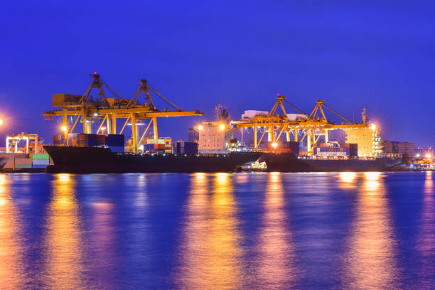 istock container,container ship in import export and business logistic,By crane,Trade Port , Shipping,cargo to harbor.Aerial view,Water transport,International,Shell Marine,transportation,logistic,trade,port 892041134