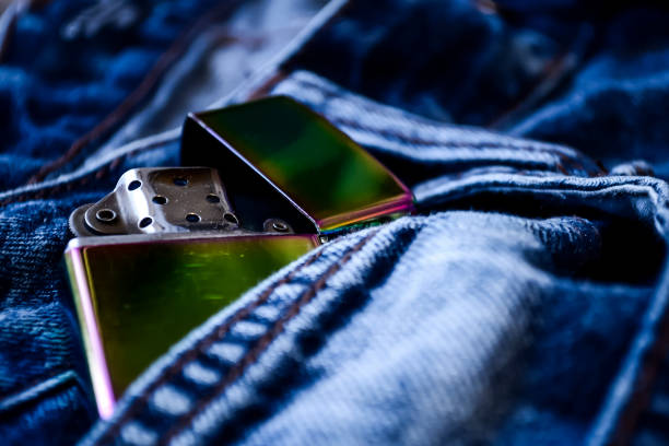 istock Denim clothes lying on the table with the glasses. Blue jeans wi 892043322
