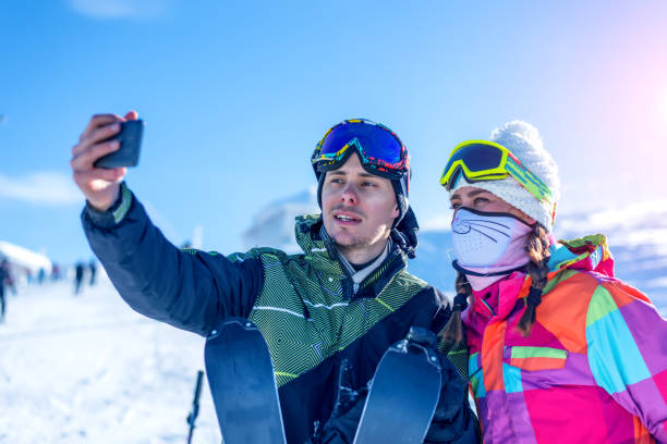 istock Couple with skis taking self-portrait 892065474