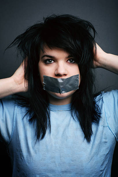 istock Black Haired Female with Duck Tape Covering Mouth 89206702