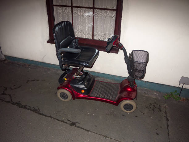 red mobility scooter parked outside in front of house disability