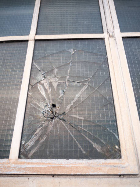 istock smashed broken window up close criminal damage vandalism crime 892070230