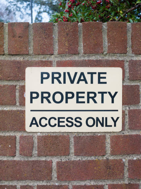 istock private property access only black and white sign on brick wall close up 892070240
