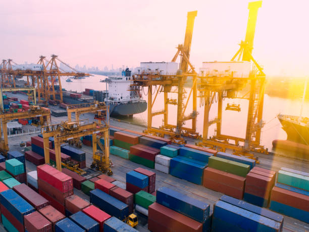 istock container,container ship in import export and business logistic,By crane,Trade Port , Shipping,cargo to harbor.Aerial view,Water transport,International,Shell Marine,transportation,logistic,trade,port 892077390