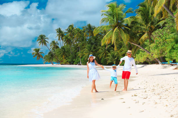 istock family with child playing on beach 892077672