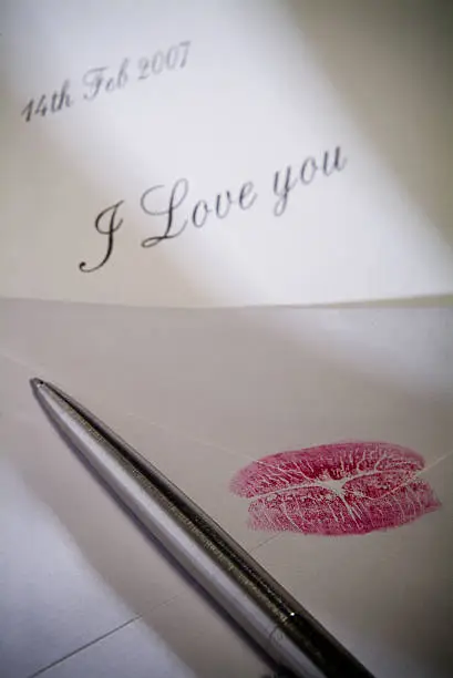 Love note with lipstick marks.