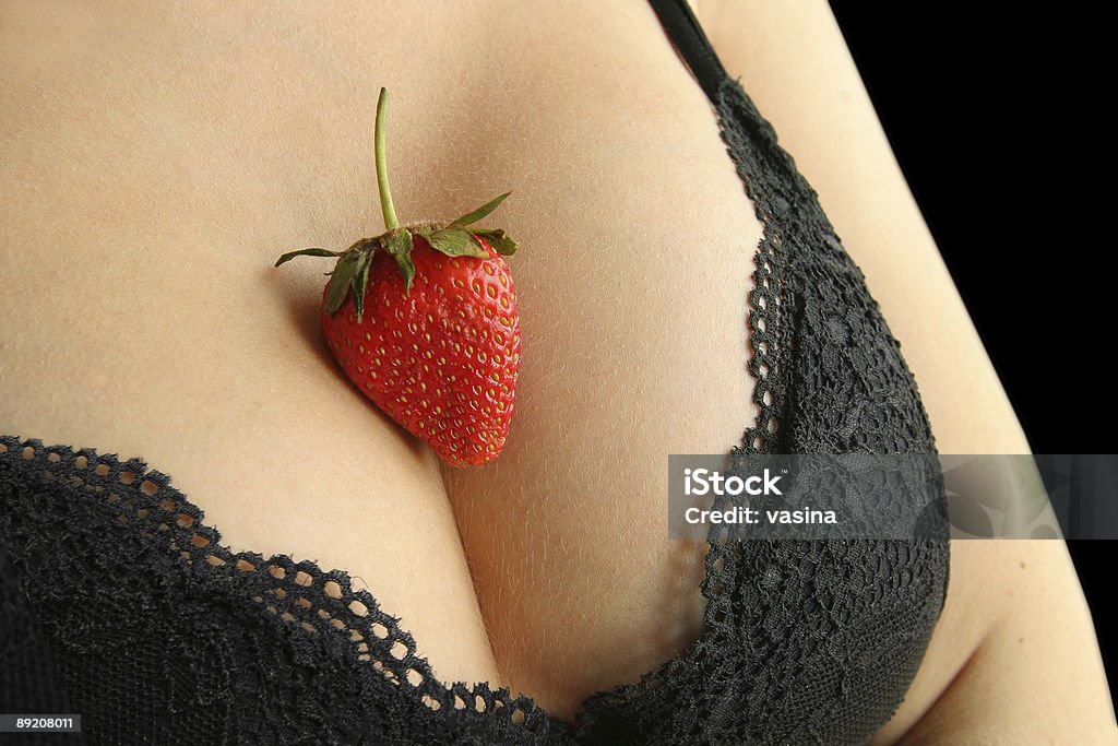 breast bra and strawberry Female breast in a bra and a strawberry  Naked Stock Photo