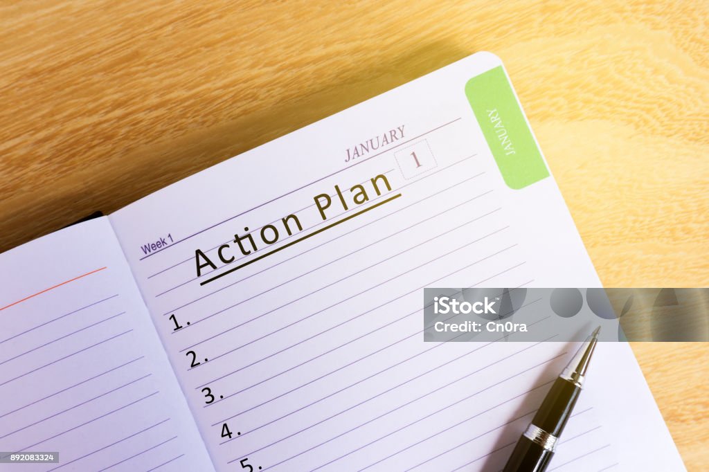 Text Action plan on Notepad Text Action plan on Notepad - New Year Concept Aspirations Stock Photo