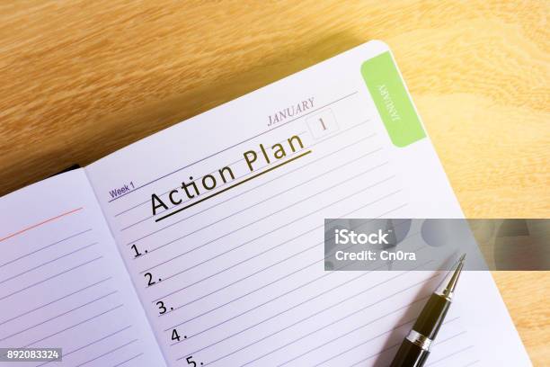 Text Action Plan On Notepad Stock Photo - Download Image Now - Aspirations, Goal - Sports Equipment, Arranging