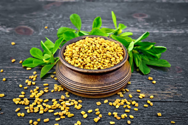istock Fenugreek with leaf in bowl on wooden board 892089068