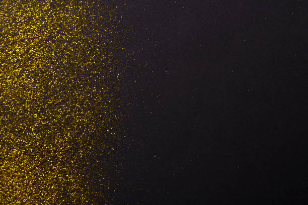 Golden glitter sand texture, abstract background.