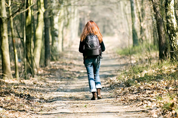 istock Woman walking through the forest 89209073