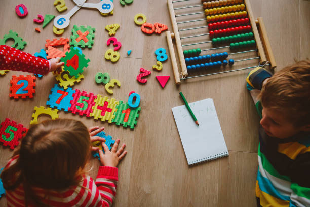 istock little boy and girl learn to calculate numbers 892092046