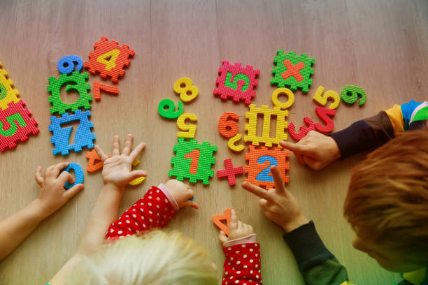 istock kids learning numbers and count with fingers 892092308