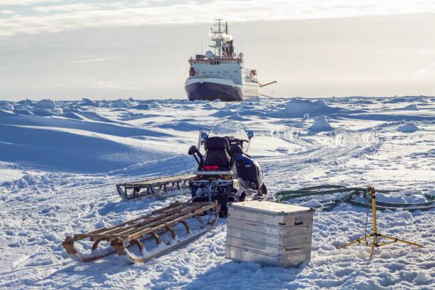 Research icebreaker and snowmobile stock photo