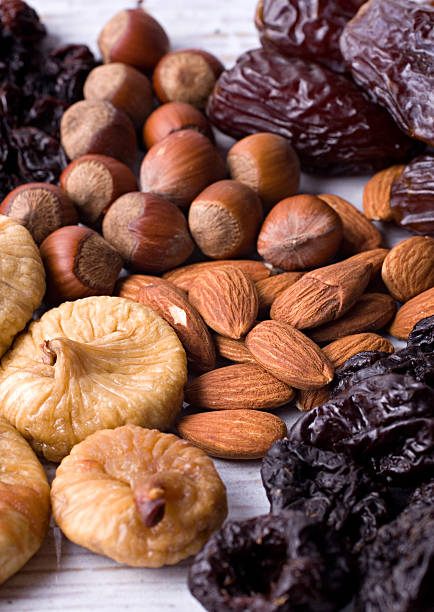 Figs, hazelnuts, almond, prunes stock photo