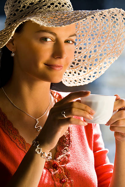 istock Beautiful Latina Hispanic Woman In A Hat Drinking Coffee 89210321