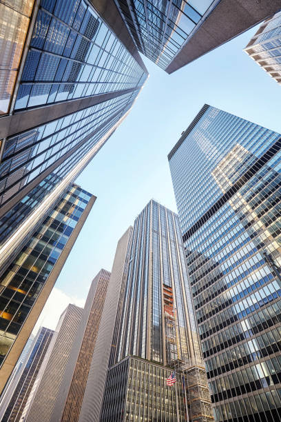 istock Looking up at New York City skyscrapers 892108944