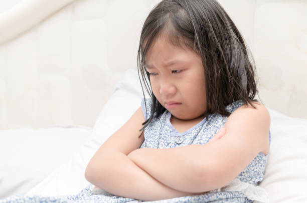 istock Little girl crying with tears on her cheeks 892115488