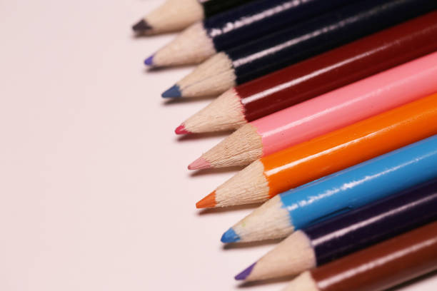 istock Multicolored pencils on the table. A stack of colored pencils ti 892117784