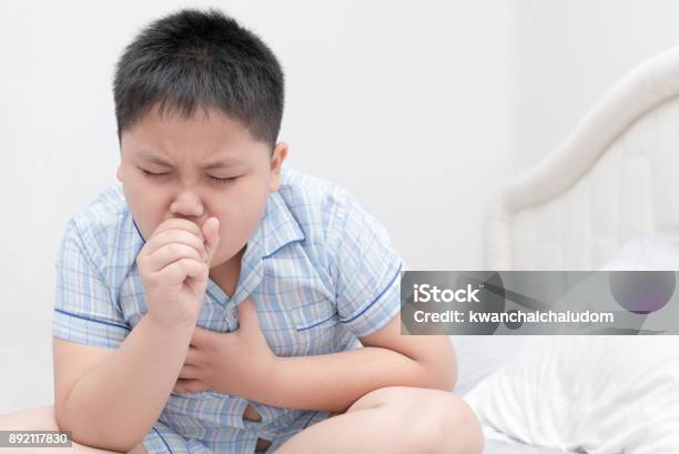 Sick Obese Boy Is Coughing And Throat Infection Stock Photo - Download Image Now - Child, Asthmatic, Coughing
