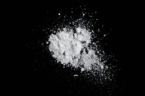 istock White powder isolated on black background, dust or powder texture 892121358