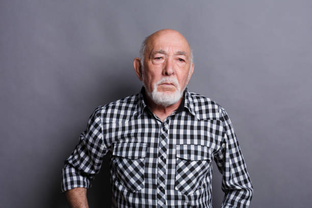 istock Mature man expressing disgust, grimacing 892125326
