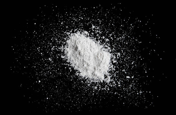 istock White powder isolated on black background, dust or powder texture 892125716