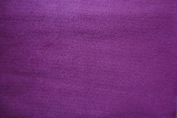 istock Purple artificial suede fabric surface from above 892126112