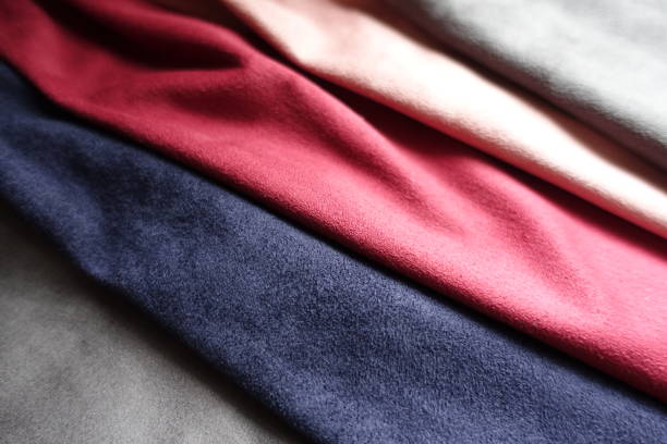 istock Close view of artificial suede in red, pink, blue, grey 892126614