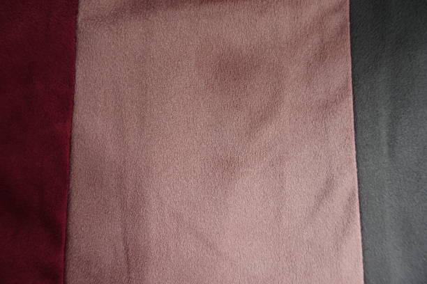 istock Vertically sewn pieces of grey, pink and red artificial suede 892128756
