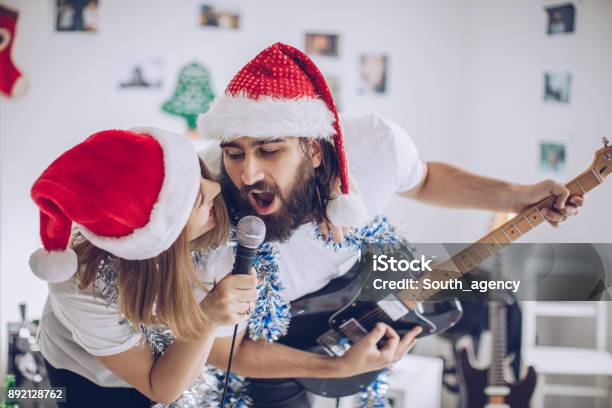 Christmas Celebration Together Stock Photo - Download Image Now - Christmas, Singing, Christmas Music