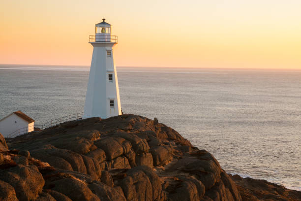 Sunny morning Cape Spear lighthouse Watching Sunrise.  Cape Spear Lighthouse National Historic Site,  the easternmost point in Canada, and North America. (52°37'W) Newfoundland & Labrador newfoundland and labrador photos stock pictures, royalty-free photos & images