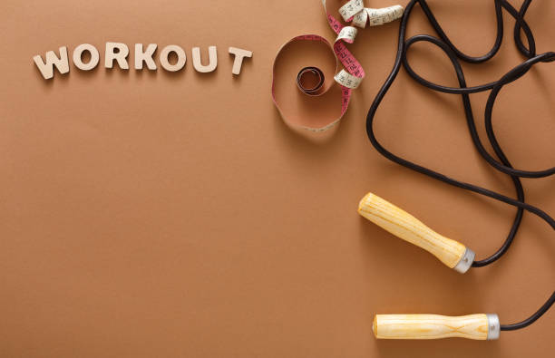 istock Fitness, jumping rope on black background 892142958