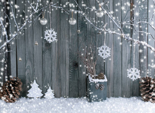 istock Christmas interior with decorative branches, cedar cones, fir tree and box on wooden planks background. 892147744