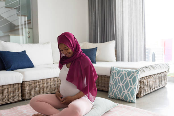 istock Pregnant woman practicing yoga 892147766