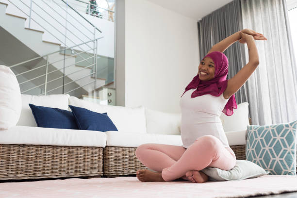 istock Pregnant woman practicing yoga 892147768