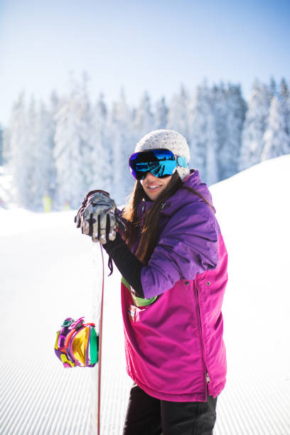 istock Winter brings snowboarders up the slope 892159838