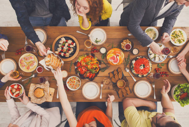 istock People eat healthy meals at served table dinner party 892159952
