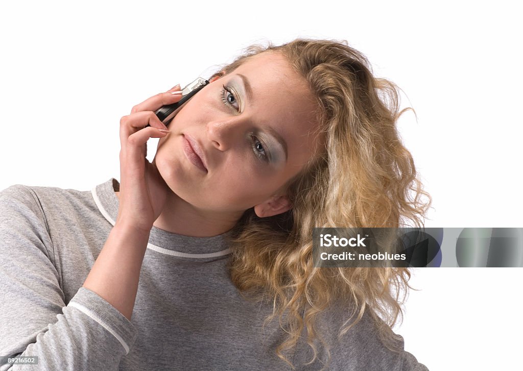 Donna con un cellulare - Foto stock royalty-free di Adolescente