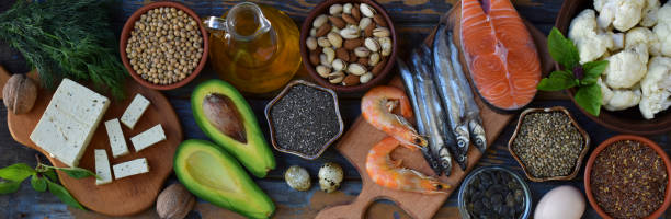 istock Composition of products containing unsaturated fatty acids Omega 3 - fish, nuts, tofu, avocado, egg, soybeans, flax, pumpkin seeds, chia, hemp, cauliflower, dill, vegetable oil. Top view. Healthy food 892176624