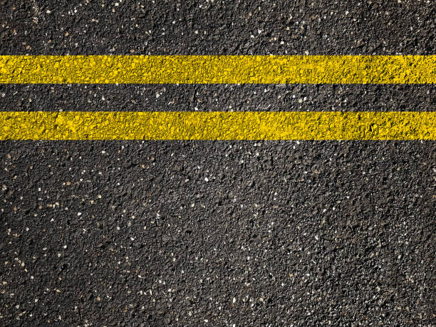 istock Asphalt road with double yellow lines 892183560