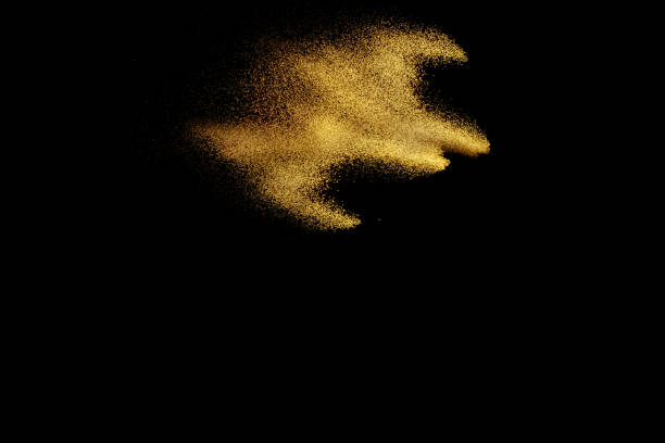 istock Yellow sand explosion isolated on black background. Abstract sand cloud. Yellow sand splash against on dark background. Sandy fly wave in the air. 892183924