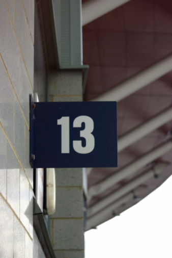 A closeup shot of number 14 on a wooden surface