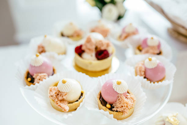 istock Table with loads of cakes, cupcakes, cookies and cakepops. 892196370