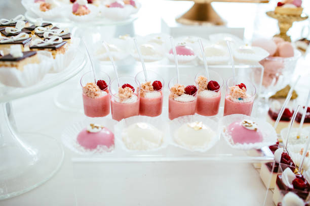 istock Table with loads of cakes, cupcakes, cookies and cakepops. 892196432