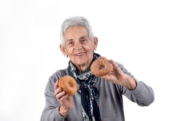 istock senior woman eating 892196804