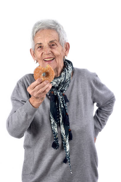 istock senior woman eating 892196808